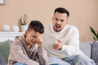 © Pixel-Shot - Crying boy with his father squabbling at home