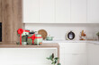 © Pixel-Shot - Different household appliances on counter as gift in kitchen