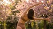 © lamio - Yoga, primavera e rinascita fisica e spirituale: donna che fa yoga in un giardino fiorito