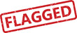 © fatimatz - A red rubber stamp with a distressed grunge texture prominently displaying the word FLAGGED