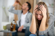 © auremar - woman despairs as man drinks beer from bottle at home
