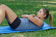 © auremar - young woman doing sit ups abdominal crunches