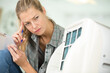 © auremar - female worker repairing air conditioner