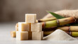 © pattozher - Sugarcane Sweetness: A close-up shot of fresh sugarcane stalks, granulated sugar, and refined sugar cubes. It creates a composition that showcases the natural sweetness of sugarcane.