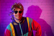 © ronstik - funny man in colorful 80s 90s fashion outfit. disco party