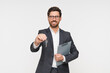 © InsideCreativeHouse - Real estate agent realtor lawyer wearing smart casual suit and glasses holding key from new apartment and clipboard contract on white background. Banker seller owner tenant ready to move in concept