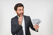 © InsideCreativeHouse - Studio shot happy rich wealthy Caucasian businessman holding cash money dollars prize financial winning excited yelling celebrate finance bet success investment isolated white background