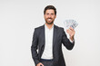 © InsideCreativeHouse - Adult rich happy employee business man corporate lawyer wear classic formal black suit shirt work in office hold fan of cash money in dollar banknotes look at camera isolated on white background