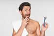 © InsideCreativeHouse - Skincare and happy man shaving face in studio for wellness, hygiene and cosmetic treatment on white background. Cleaning, beauty and Caucasian model with facial, hair removal and razor blade