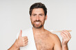 © InsideCreativeHouse - Portrait, man and brushing teeth for hygiene in studio with oral care and toothpaste with whitening results. Guy, dental and bamboo brush with clean mouth for healthy gums by white background
