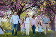 © Halfpoint - Three generation family on walk in spring nature.