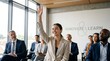 © Artem Zatsepilin - smiling asian woman raising hand during business seminar in modern office. multi-ethnic professionals learning. corporate training, education, workshop. website header, banner.