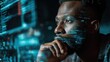 © Adriana - Futuristic software and hardware , coding hologram, serious concentrated man thinking about data analytics, digital technology. Programmer programming cybersecurity research and IT