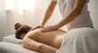 © MstNazma - Massage therapist working on woman's back