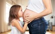 © BillionPhotos.com - Happy child holding belly of the pregnant mother