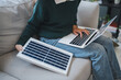 © Charlie's - Home owner install solar power systems in her house Asian Woman learning about sustainable technology