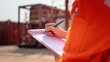 © Nattawit - Action of safety officer is writing and check on checklist document during safety audit and inspection at drilling site operation. Industrial expertise occupation working scene.