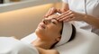 © ANDREY PROFOTO - Young woman receiving relaxing facial massage at luxury spa