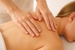 © whitestorm - Woman receiving a relaxing back massage at a spa, emphasizing hands and shoulders, promoting wellness, body care, and holistic healing in a tranquil setting, professional touch.