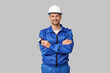 © Pixel-Shot - Portrait of male electrician with multimeter on grey background
