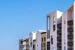 © yaqui_villegas - Modern residential apartments architecture facade with minimalism and skyline in Port Marianne Montpellier France presenting new housing district