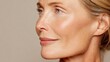 © Jam - A mature woman poses with a side profile showcasing her skin. She looks ready for a beauty product advertisement