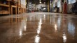 © Bussakon - A wet shiny concrete floor in an industrial workshop or factory reflecting overhead lights suggesting a clean and recently worked on space