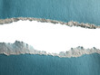 © robiinternet - Torn blue paper with white edges isolated on a transparent background