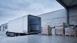 © K4VEE - A clean industrial loading dock shows an open refrigerated truck backed in beside shrink-wrapped pallets ready for cold chain distribution under cool overcast daylight with generous copy space.
