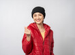 © Chanakon - Young beauty Asian woman feeling cold. Wearing winter coat hoodie. For winter season weather. Fashion winter end year snow and christmas on isolated background