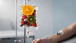 © Oleksandr - Intravenous Therapy of Mixed Fresh Fruits for Vitamin Infusion and Wellness, Healthy Boost, IV Drip Treatment, and Alternative Medicine in a Clinical Setting
