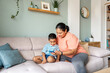 © ADDICTIVE STOCK - Mother and son bonding time at home
