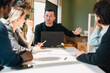 © chokniti - Business Presentation of Marketing Plan and Data Analysis in Modern Office, Young Professional Presenting Strategy, KPI Metrics and Project Workflow to Team During Corporate Meeting