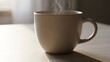© Alleuy - Steaming mug on a table in natural light beverage concept