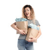 © New Africa - Excited woman with bags full of money on white background