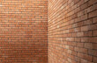 © Rattanachat - A brick wall with a corner cut off