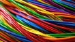 © Formoney - Bunch of colorful wires are shown in a close up. The wires are of different colors and are twisted together. Concept of chaos and disorder, as the wires are tangled and intertwined