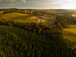 © Nicholas - Drone aerial view of misty mountain farmland in New South Wales, Australia, showing rural agricultural paddocks, forested valleys and rolling highlands under low cloud and fog