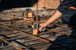 © standret - Close up view of man's hand that is using leveling tool on the floor, construction site