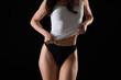 © Pixel-Shot - Pretty young woman in underwear on black background