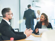 © peopleimages.com - Meeting, advisor and business people with discussion, paperwork and financial development ideas. Man, woman and conversation in office for strategy, planning and proposal for growth at consultancy