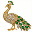 © Gregory - Elegant peacock brooch with green emeralds and sparkling diamonds in luxurious style for jewelry and fashion themes [with copy space]