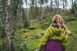 © Johnér - Rear view of blond girl hiking in forest