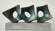 © Sulaiman - Gleaming bronze abstract sculptures displaying dynamic linked forms resting on a sturdy stone base, showcasing a modern artistic expression.