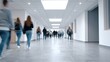 © Дмитрий Баронин - Students walking through a modern college corridor with bright overhead lights, large windows, and a spacious layout, showcasing a contemporary educational environment and active campus life