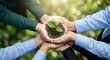 © lianlian liang - Group of people hands holding glass globe with green plant sprout inside for ecology, nature conservation and teamwork concept