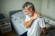 © Geber86 - Older man with shoulder pain in bedroom