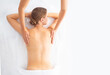 © Acronym - Young woman getting massaging treatment over white. Spa, healthcare and recreation concept.