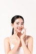 © Areerat - Beautiful young woman with cleaning skin hands touching face, for cosmetics and facial care concept.