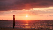 © Sangiao_Photography - Man finding solitude on beach watching sunset